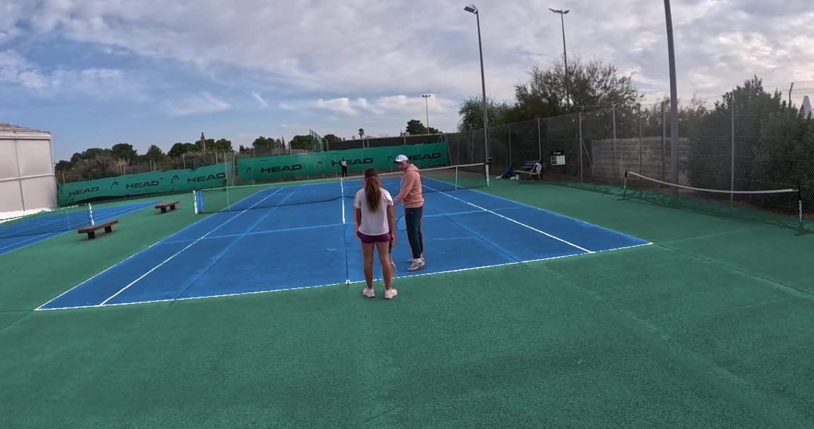 Geoffroy Dupuis coaching a junior player on a blue hard court near Montpellier